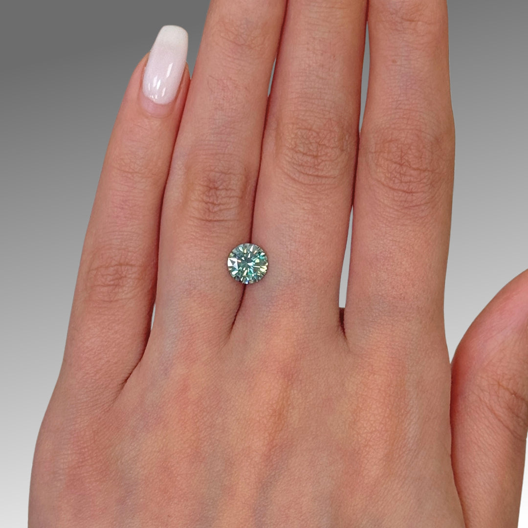7mm ( DEW 1.2ct) round aqua-teal moissanite