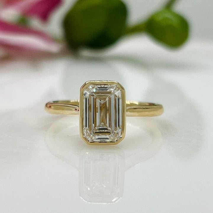 AGI Design Ray Radiant/Emerald Lab Created Diamond Bezel Engagement Ring