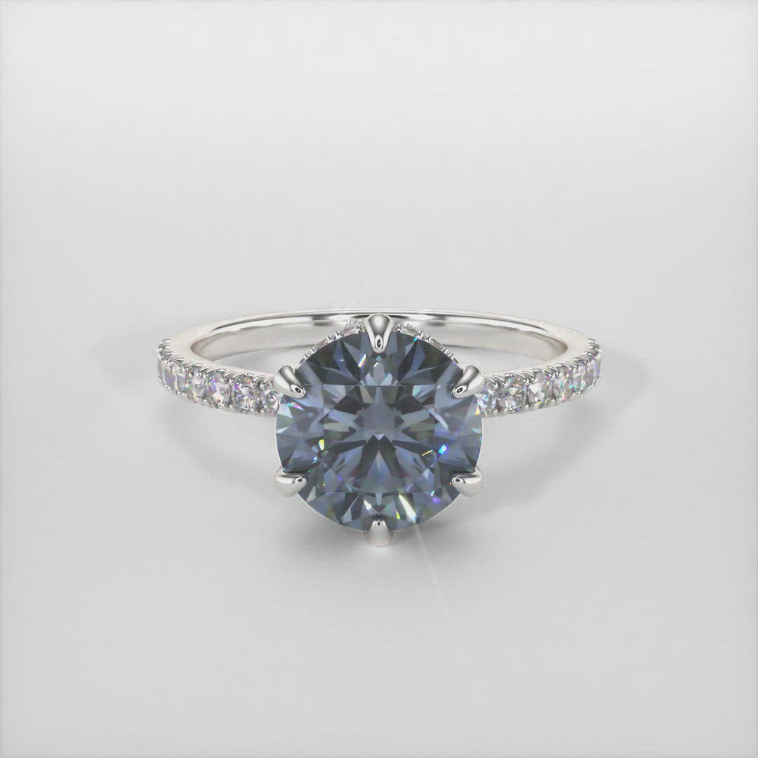 Jenny dark gray moissanite engagement ring/AGI Design/This incredible engagement ring in gold or platinum features a round gray Moissanite in a 6 prong setting surrounded by a hidden halo of round lab-created brilliant diamonds that make their way down the ring’s shank. This 1ct, 2ct solitaire  ring is designed to allow the wedding band to sit close and flush with the engagement ring. 