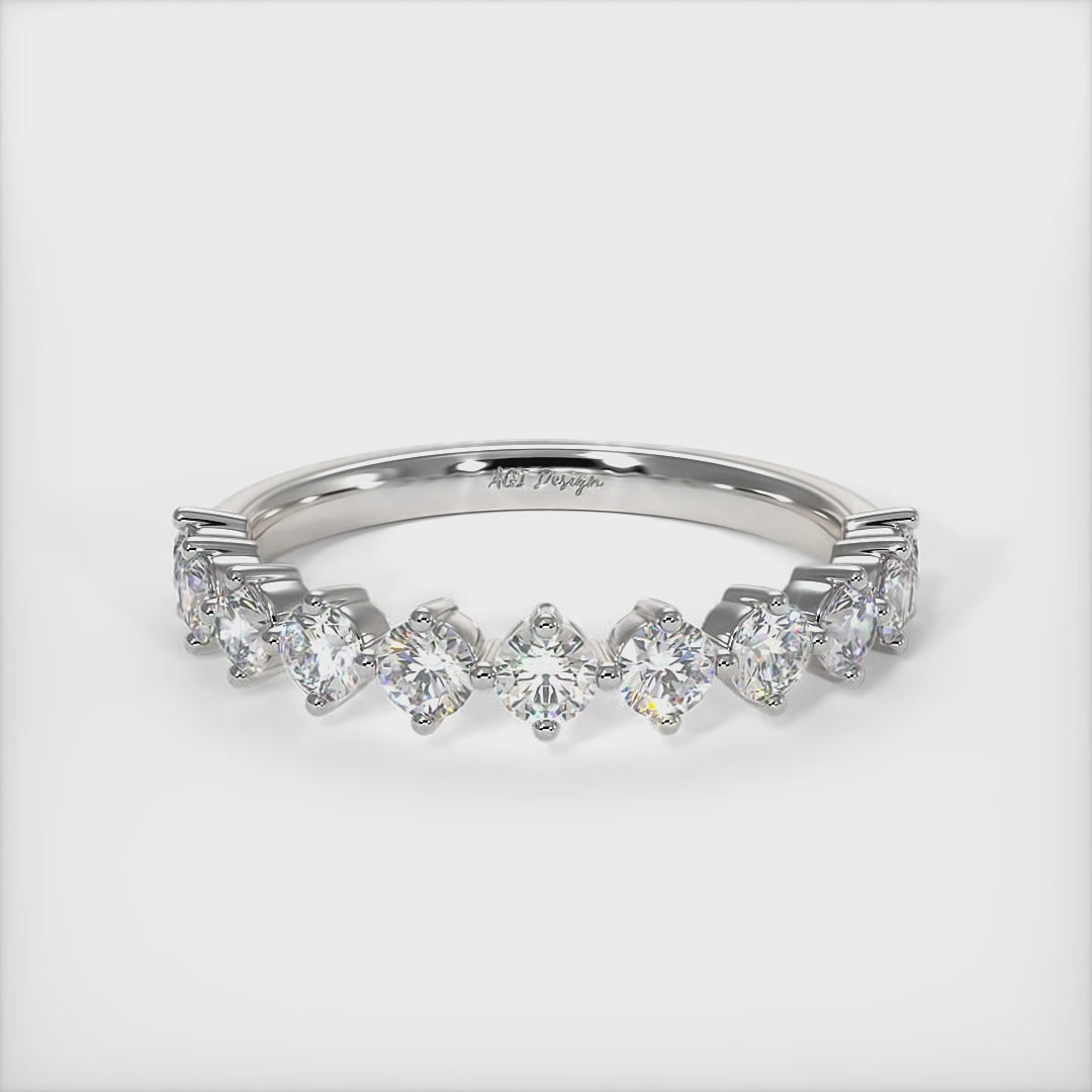 Delicately crafted in solid gold or platinum, this band is 3mm wide set with round brilliant cut Lab-created diamonds. This bridal ring can be made with moissanite./AGI Design