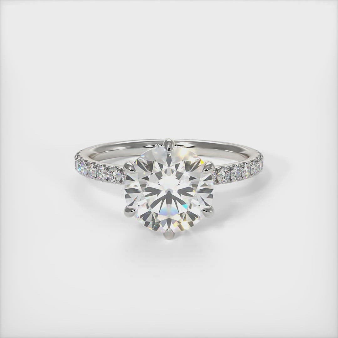 Evie round moissanite engagement ring/AGI Design/A beautiful Engagement ring in gold or platinum that includes a round Colorless  Moissanite set into the 6 prongs setting and high-quality lab-created diamonds on the band. This 1ct, 2ct, 3ct solitaire ring is designed to allow the wedding band to sit close and flush with the engagement ring because the center stone sits directly above the band. 