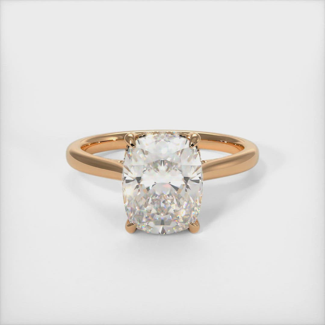 Bella Elongated Cushion Moissanite Engagement Ring. Celebrate your love with a unique and stylish elongated cushion-shaped engagement ring. A unique choice she’ll love, this engagement ring elevates her style. Crafted in solid gold or platinum, this intriguing design features a sparkling cushion-shaped moissanite center stone wrapped in a lab-created diamond-adorned hidden hallo frame. AGI Design