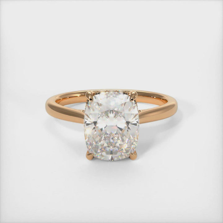 Bella Elongated Cushion Moissanite Engagement Ring. Celebrate your love with a unique and stylish elongated cushion-shaped engagement ring. A unique choice she’ll love, this engagement ring elevates her style. Crafted in solid gold or platinum, this intriguing design features a sparkling cushion-shaped moissanite center stone wrapped in a lab-created diamond-adorned hidden hallo frame. AGI Design