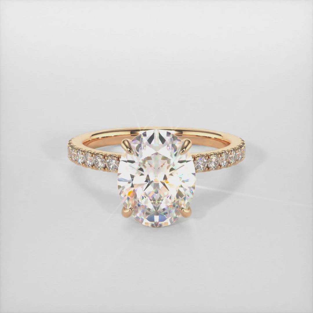 Cathy oval moissanite engagement ring/AGI Design This breathtaking engagement ring in gold or platinum features an Oval colorless Moissanite adorned with a collar of lab-created diamonds that continue down the ring shank. This solitaire ring is available in variety of sizes including 1ct, 2ct, 3ct 