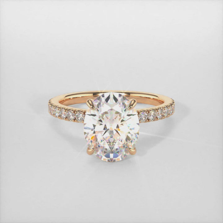 Cathy oval moissanite engagement ring/AGI Design This breathtaking engagement ring in gold or platinum features an Oval colorless Moissanite adorned with a collar of lab-created diamonds that continue down the ring shank. This solitaire ring is available in variety of sizes including 1ct, 2ct, 3ct 