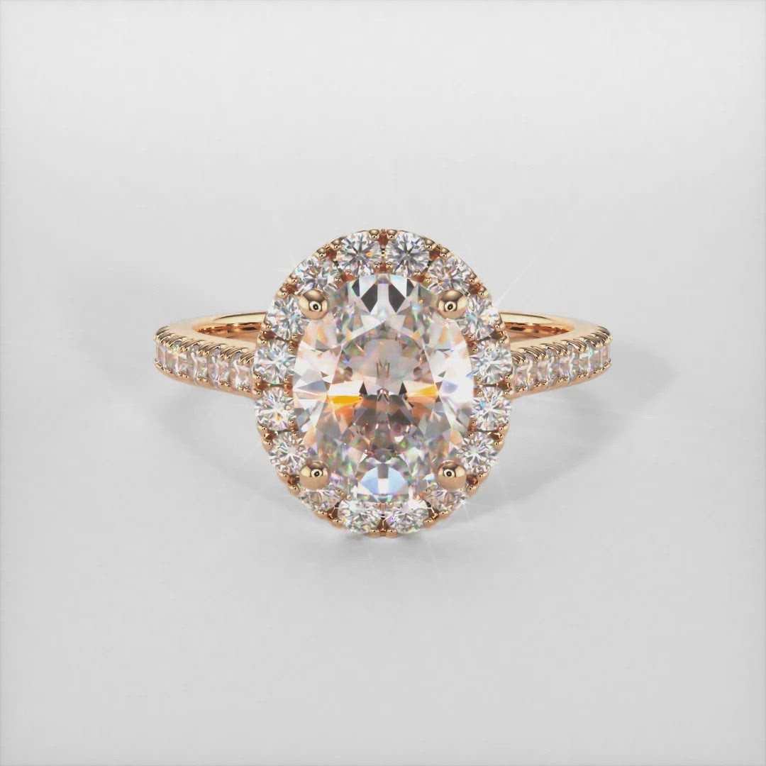 Emory oval moissanite engagement ring/AGI Design/This ring in gold or platinum has a lab-diamonds halo surrounding the center  oval moissanite, along with a small hidden or "collar" halo underneath the center to add a little detail and a unique look. The main stone is a colorless Moissanite and accent stones are Lab-Created diamonds SI-VS quality and E-F color. 