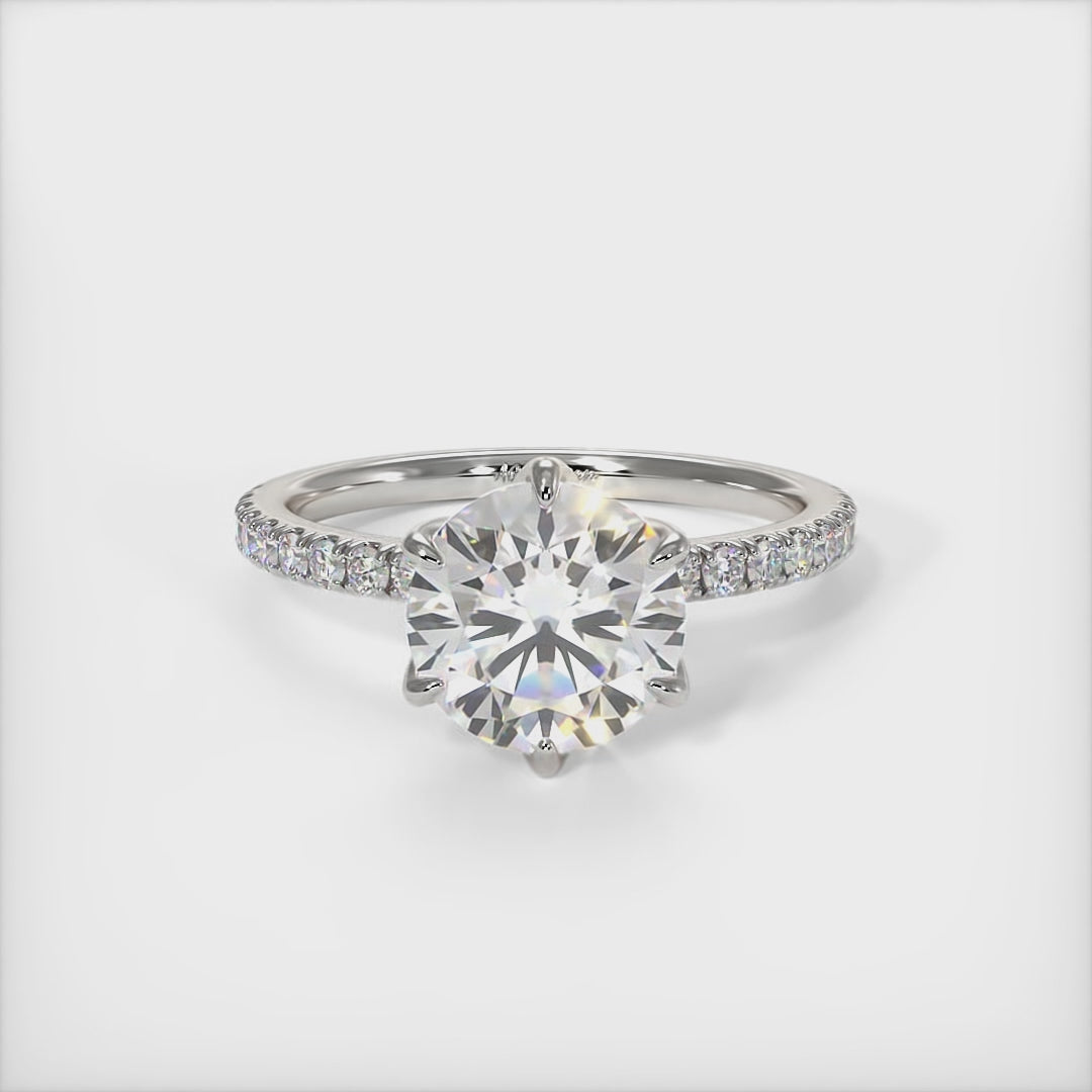 This gorgeous round Moissanite and Lab-Created Diamonds Engagement Ring is sure to thrill her! This lovely sparkling bridal ring in gold or platinum features a 1ct, 2ct round Moissanite set into the elegant 6 prong tulip head. A shimmering diamond-lined shank completes the lovely look. AGI Design