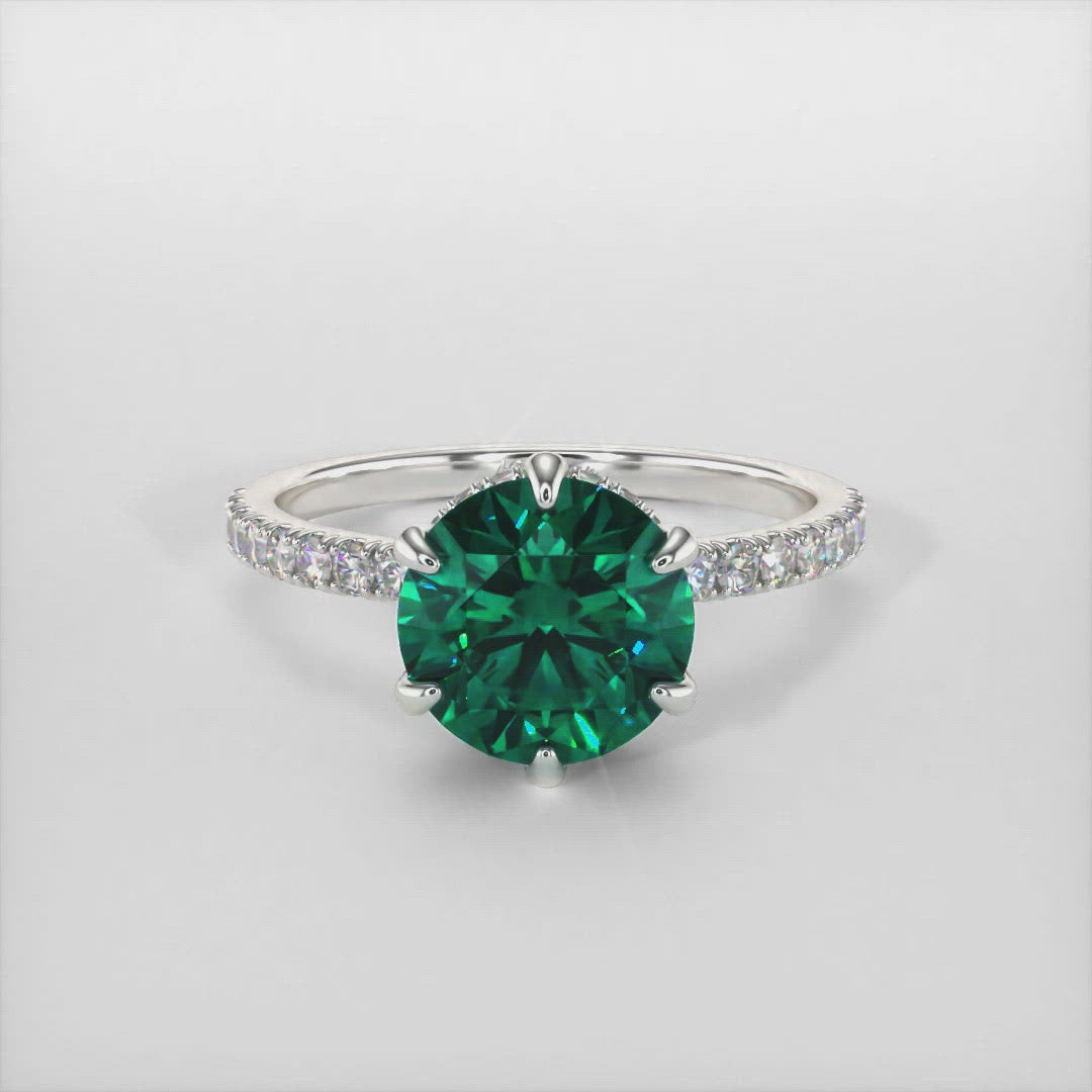 Jenny green round moissanite engagement ring/AGI Design/This incredible engagement ring in gold or platinum features a round green Moissanite in a 6 prong setting surrounded by a hidden halo of round lab-created brilliant diamonds that make their way down the ring’s shank. This 1ct, 2ct solitaire  ring is designed to allow the wedding band to sit close and flush with the engagement ring. 