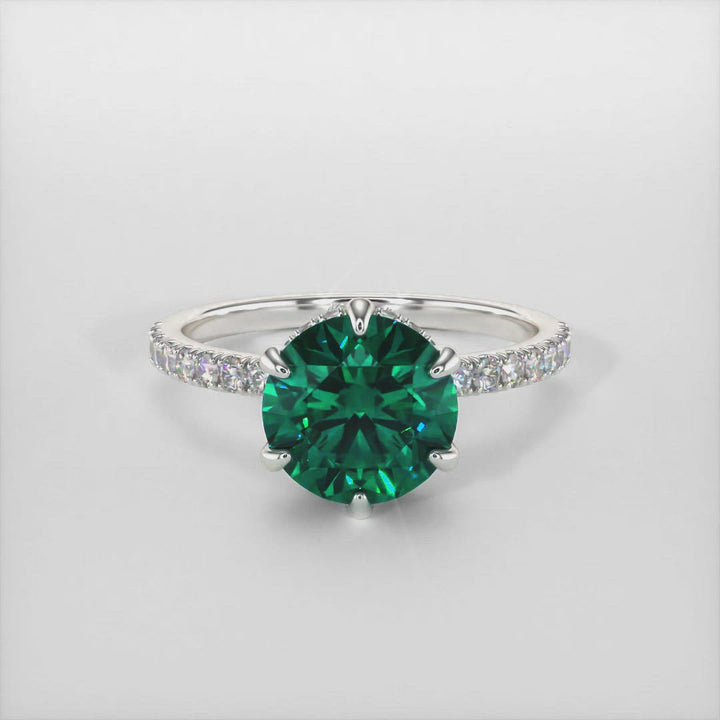 Jenny green round moissanite engagement ring/AGI Design/This incredible engagement ring in gold or platinum features a round green Moissanite in a 6 prong setting surrounded by a hidden halo of round lab-created brilliant diamonds that make their way down the ring’s shank. This 1ct, 2ct solitaire  ring is designed to allow the wedding band to sit close and flush with the engagement ring. 