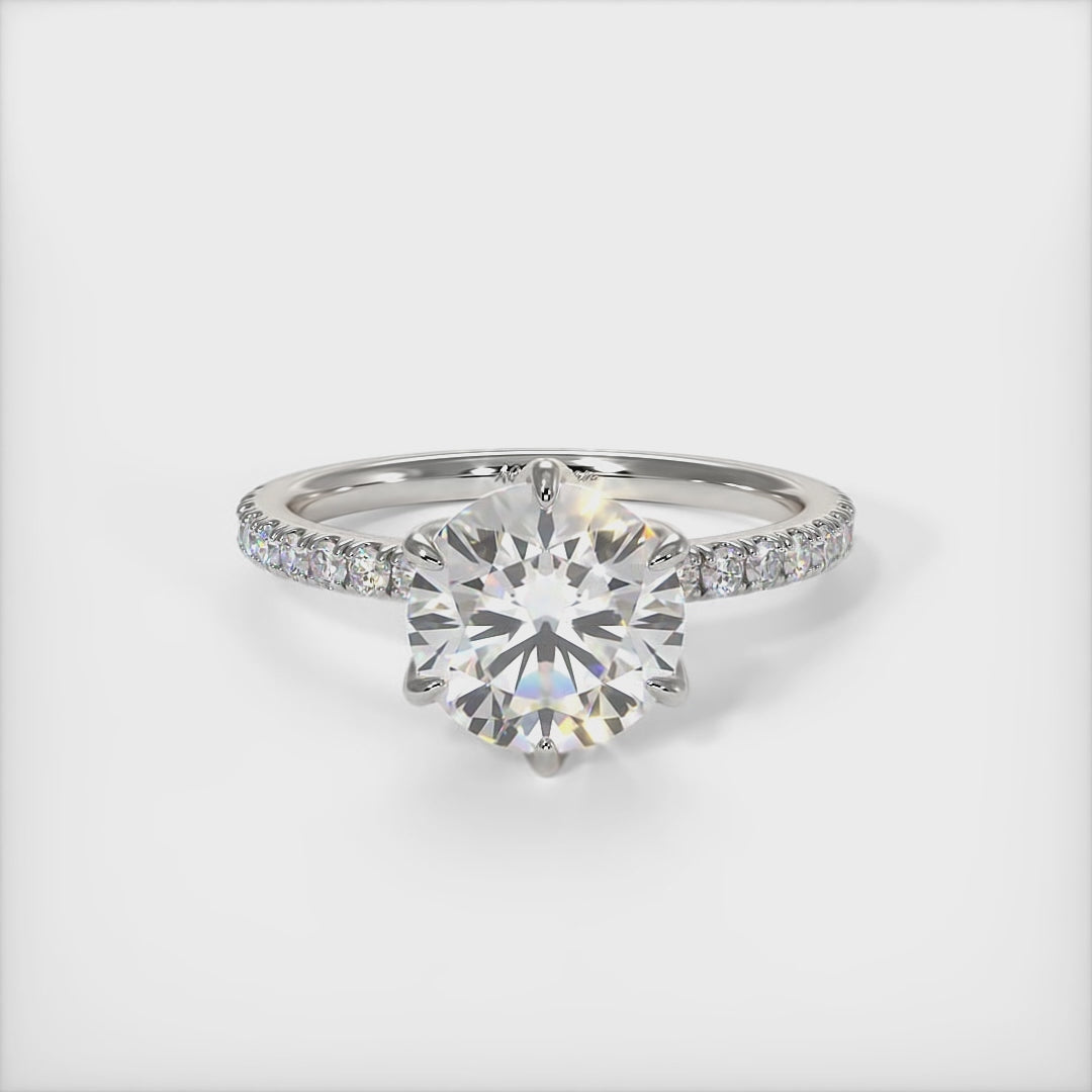 This gorgeous round Colorless Moissanite and Lab-Created Diamonds Engagement Ring is sure to thrill her! This lovely sparkling ring  in gold or platinum features a round Moissanite set into the elegant 4 prong tulip head.  This 1ct, 2ct 3ct  solitaire ring is designed to sit flush with a straight band./AGI Design