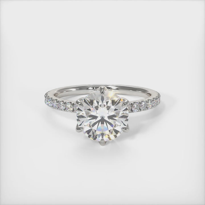 This gorgeous round Colorless Moissanite and Lab-Created Diamonds Engagement Ring is sure to thrill her! This lovely sparkling ring  in gold or platinum features a round Moissanite set into the elegant 4 prong tulip head.  This 1ct, 2ct 3ct  solitaire ring is designed to sit flush with a straight band./AGI Design