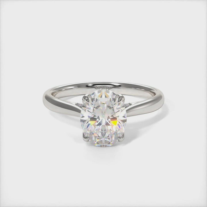 Nora Oval Moissanite Tulip Engagement Ring - AGI Design/This gorgeous Colorless oval Moissanite and Lab-Created Diamonds Engagement Ring is sure to thrill her! This lovely sparkling bridal ring in gold or platinum features a 1ct, 2ct oval Moissanite set into the elegant 4 prong tulip head. A shimmering diamond-lined shank completes the lovely look.