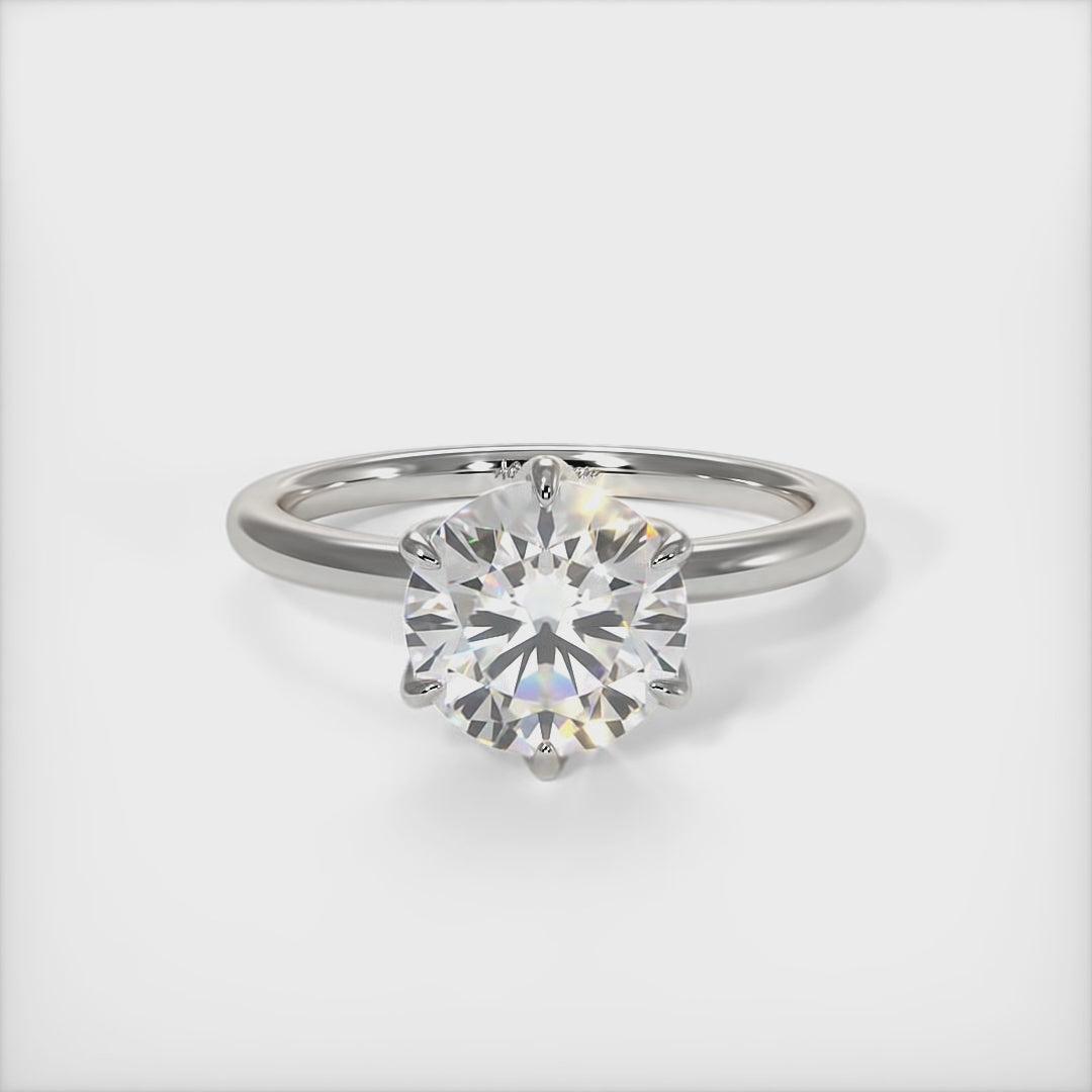 This gorgeous round Moissanite and Lab-Created Diamonds Engagement Ring is sure to thrill her! This lovely sparkling bridal ring in gold or platinum features a 1ct, 2ct round Moissanite set into the elegant 6 prong tulip head. A shimmering diamond-lined shank completes the lovely look. AGI Design