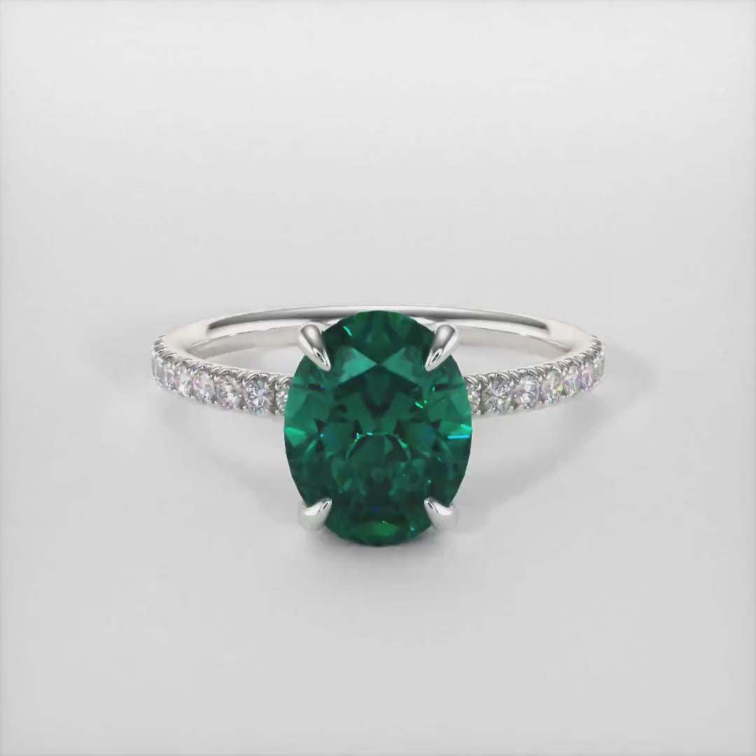 Abigail Oval Green Moissanite Engagement Ring/ AGI Design. A beautiful engagement ring in gold or platinum that includes a green Oval Moissanite set into the 4 prongs hidden halo setting. The band and the halo are covered with lab-created diamonds. This solitaire ring is designed to allow the wedding band to sit  flush with the engagement ring because the center stone sits directly above the band.