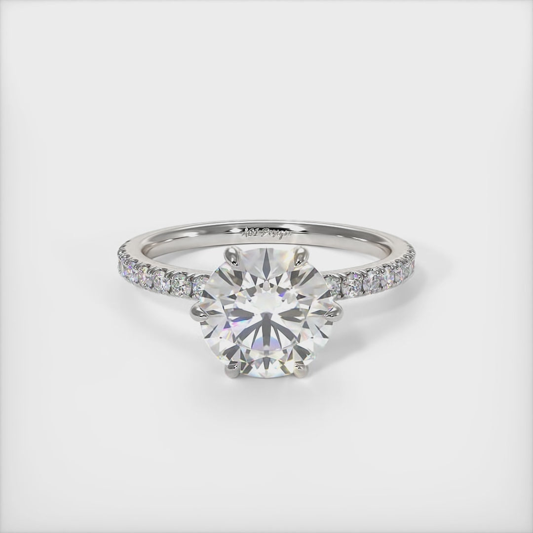 This gorgeous round Colorless Moissanite and Lab-Created Diamonds Engagement Ring is sure to thrill her! This lovely sparkling ring  in gold or platinum features a round Moissanite set into the elegant 4 prong tulip head.  This 1ct, 2ct 3ct  solitaire ring is designed to sit flush with a straight band./AGI Design