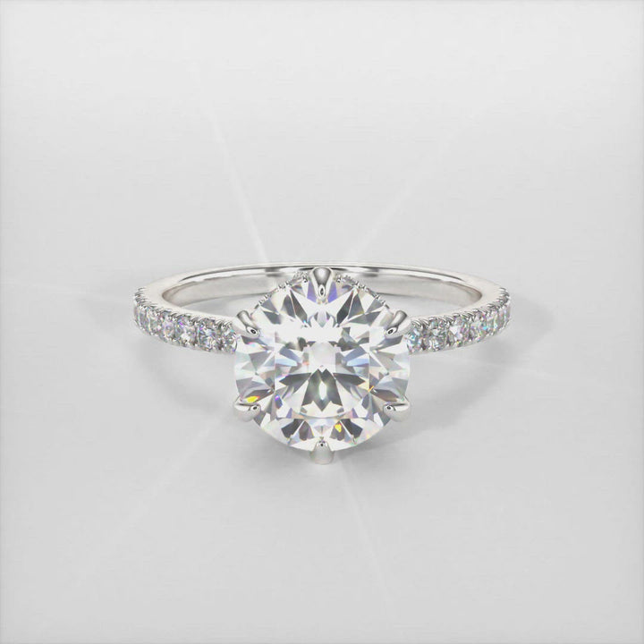 Jenny round moissanite engagement ring/AGI Design/This incredible engagement ring in gold or platinum features a round moissanite in a 6 prong setting surrounded by a hidden halo of round lab-created brilliant diamonds that make their way down the ring’s shank. This 1ct, 2ct solitaire  ring is designed to allow the wedding band to sit close and flush with the engagement ring.