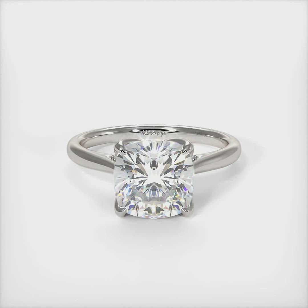 Nora Cushion Cut Moissanite Tulip Engagement Ring - AGI Design/This gorgeous Colorless Cushion Cut Moissanite and Lab-Created Diamonds Engagement Ring is sure to thrill her! This lovely sparkling bridal ring in gold or platinum features a 1ct, 2ct Cushion Cut Moissanite set into the elegant 6 prong tulip head. A shimmering diamond-lined shank completes the lovely look.