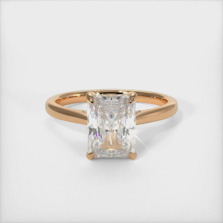 Bella radiant moissanite engagement ring/AGI Design  Crafted in solid gold or platinum, this intriguing design features a sparkling radiant-shaped Forever One moissanite center stone wrapped in a lab-created diamond-adorned hidden hallo frame. Sizes 1.2ct, 2.7ct, and 3.9ct are available for this unique solitaire ring 