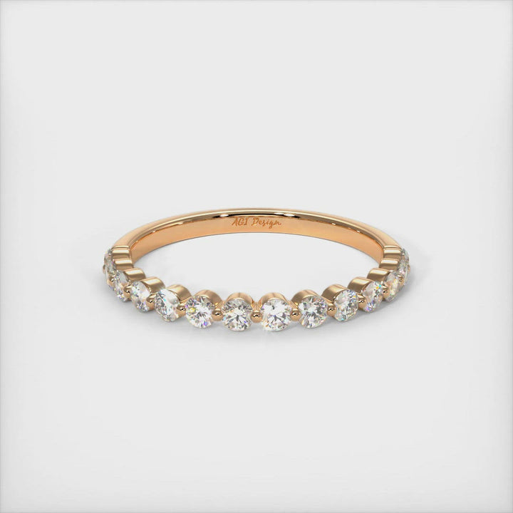 This exquisite ladies diamond semi-eternity band in gold or platinum features a 2mm Lab-Created diamonds set in a unique, low-profile setting and can be used as a wedding band or anniversary ring. AGI Design
