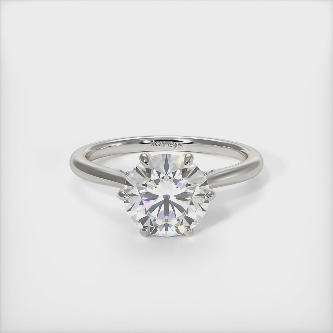 This gorgeous round Moissanite and Lab-Created Diamonds Engagement Ring is sure to thrill her! This lovely sparkling bridal ring in gold or platinum features a 1ct, 2ct round Moissanite set into the elegant 6 prong tulip head. A shimmering diamond-lined shank completes the lovely look./AGI Design