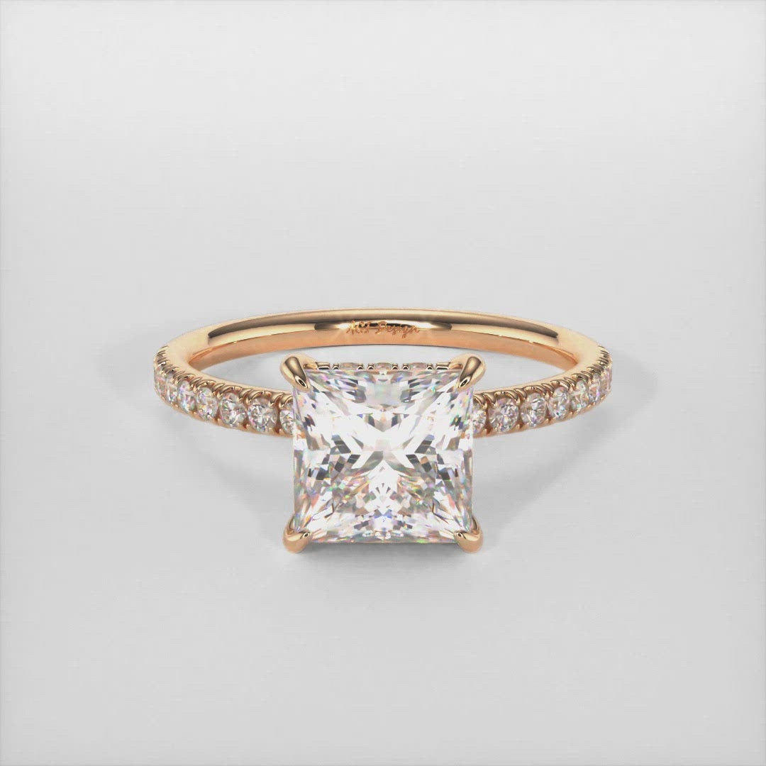 The gorgeous Hidden halo princess cut colorless moissanite engagement ring made of 14k, 18k gold, or platinum. The band and the halo are covered with high-quality Lab-created diamonds.  This ring is designed to allow the wedding band to sit close and flush with the engagement ring because the center stone sits directly above the band. AGI Design