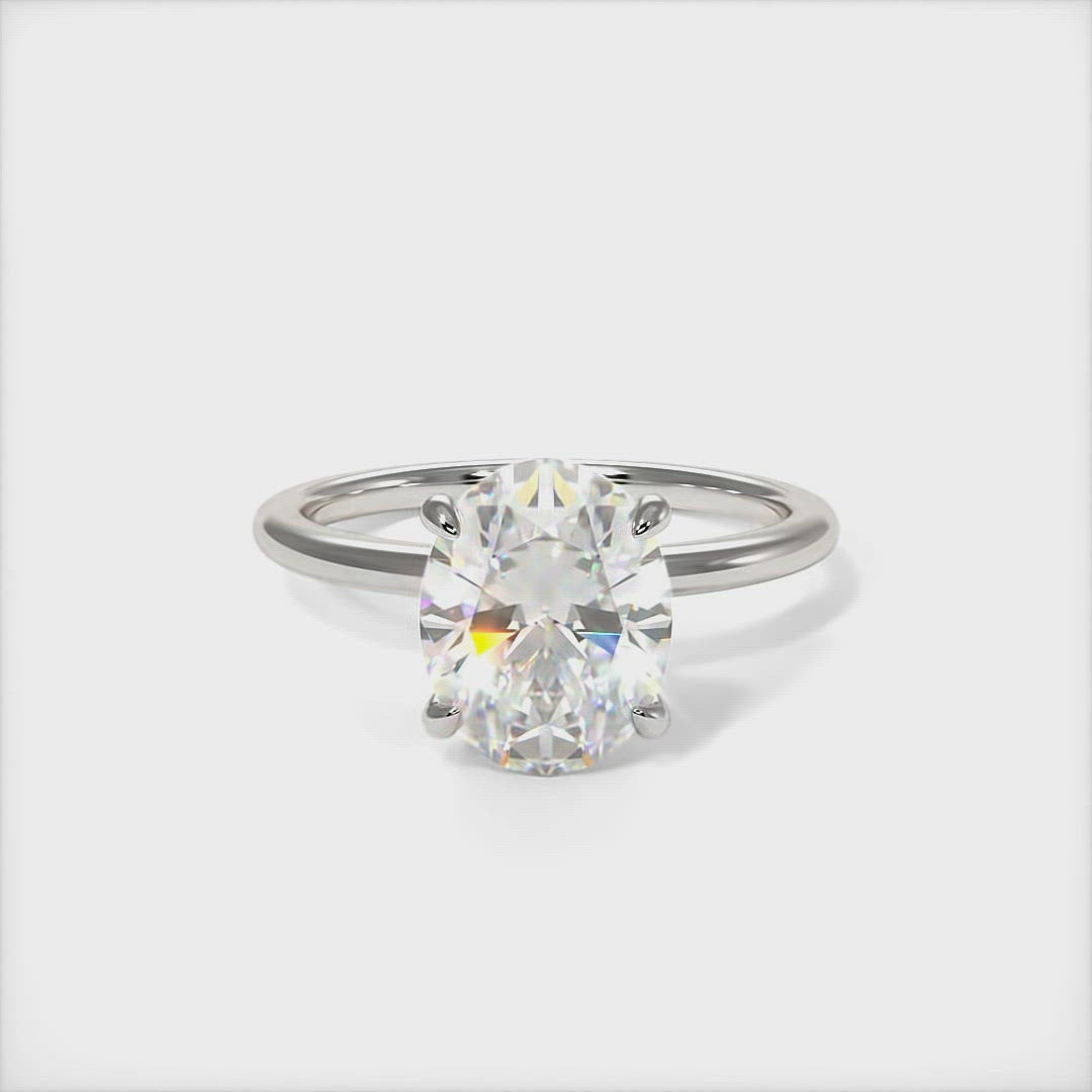 Grace oval moissanite engagement ring/AGI Design/ The delicate  engagement ring in gold or platinum features oval Colorless Moissanite as a center stone. The collar is covered with high-quality Lab-created diamonds. This 1ct, 2ct, 3ct solitaire ring is designed to allow the wedding band to sit close and flush with the engagement ring because the center stone sits directly above the band.