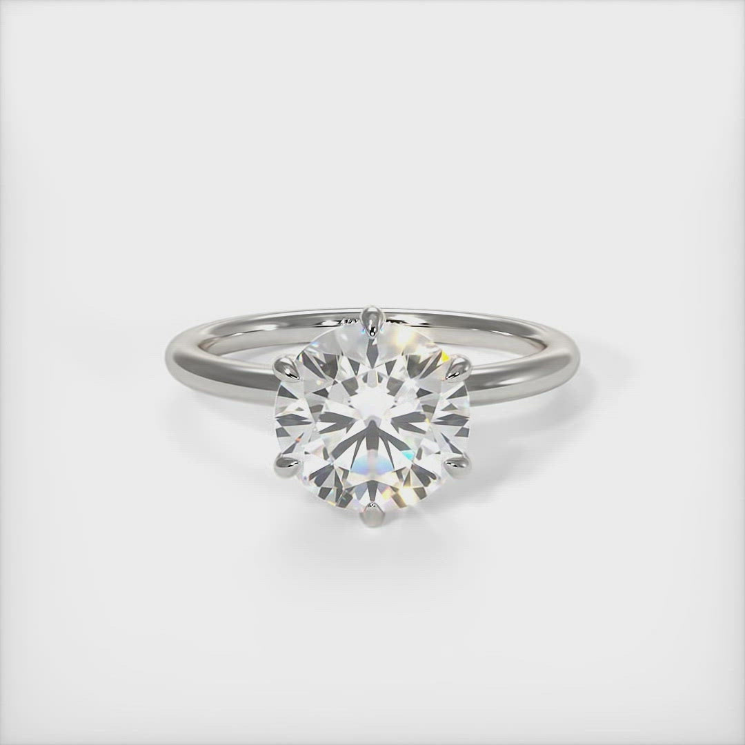 Eva round moissanite engagement ring/AGI Design/A beautiful engagement ring in gold or platinum that includes a Colorless Round Moissanite set into the 6 prongs setting. This 1ct, 2ct, 3ct solitaire ring is designed to allow the wedding band to sit close and flush with the engagement ring because the center stone sits directly above the band. 