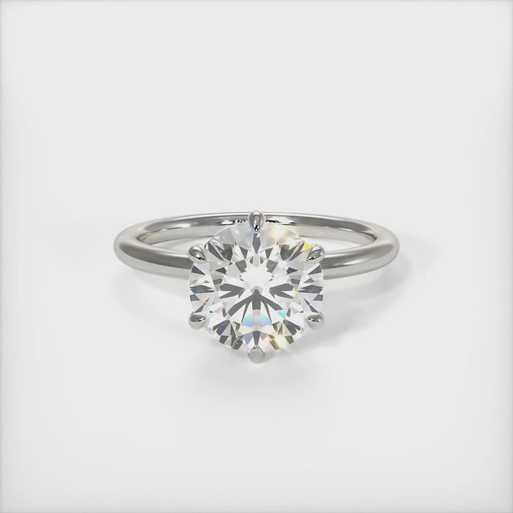 Eva round moissanite engagement ring/AGI Design/A beautiful engagement ring in gold or platinum that includes a Colorless Round Moissanite set into the 6 prongs setting. This 1ct, 2ct, 3ct solitaire ring is designed to allow the wedding band to sit close and flush with the engagement ring because the center stone sits directly above the band. 